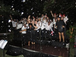 Christmas Carols in the rain at a packed Government House on Monday evening