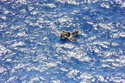 RCIPS Police Helicopter Assists with Rescue of Migrants at Sea, Along with CBC, CIFS and CICG